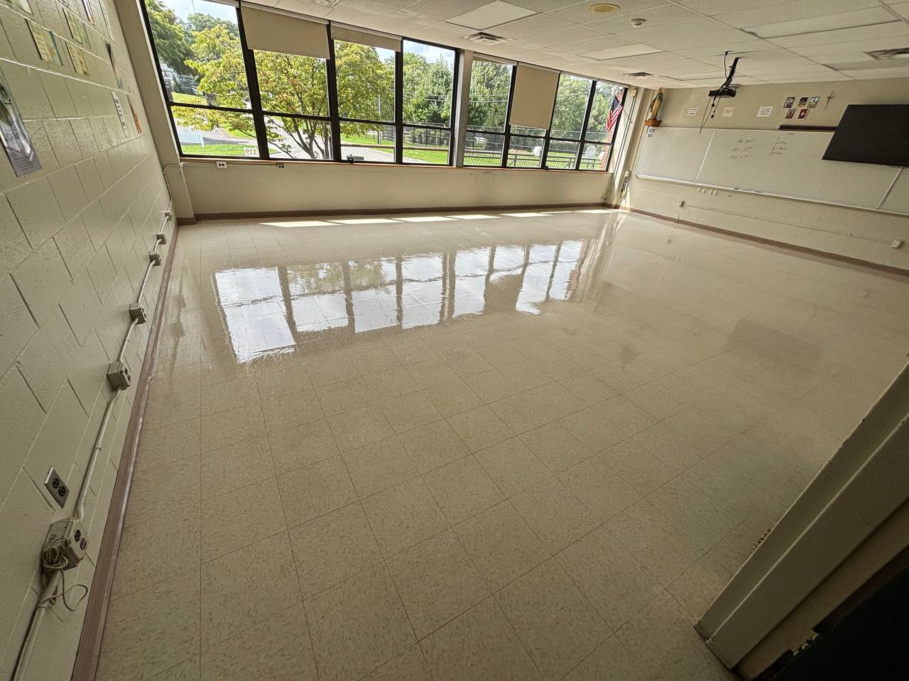 Classroom hard flooring reflecting daylight from windows