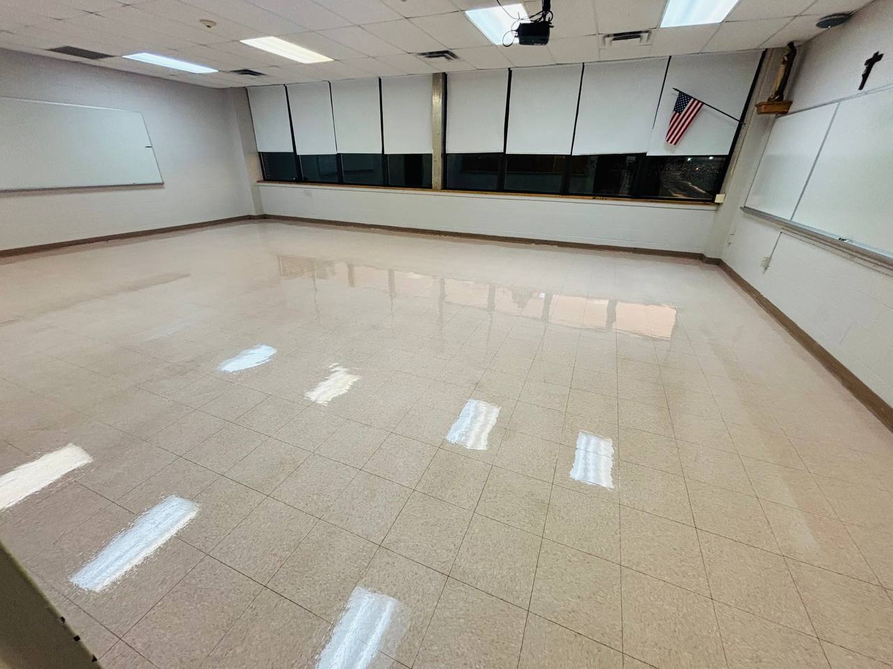 Classroom flooring showing reflections from overhead lights