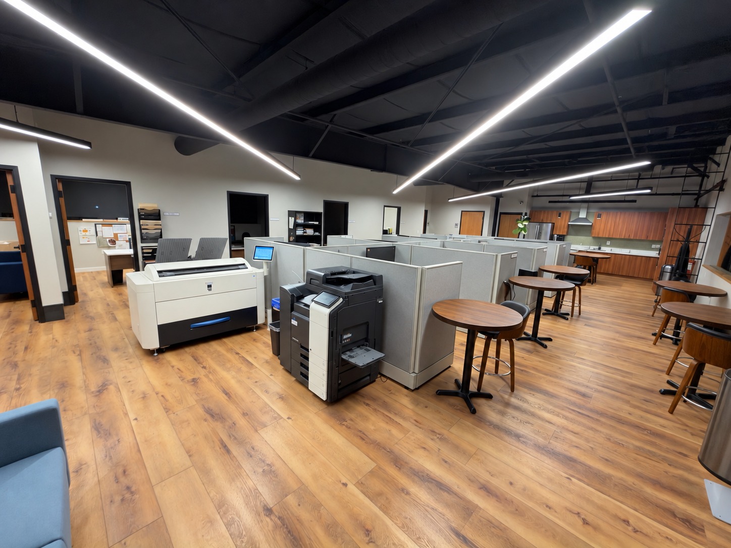 Commercial office workspace with cubicles and hard-surface floors